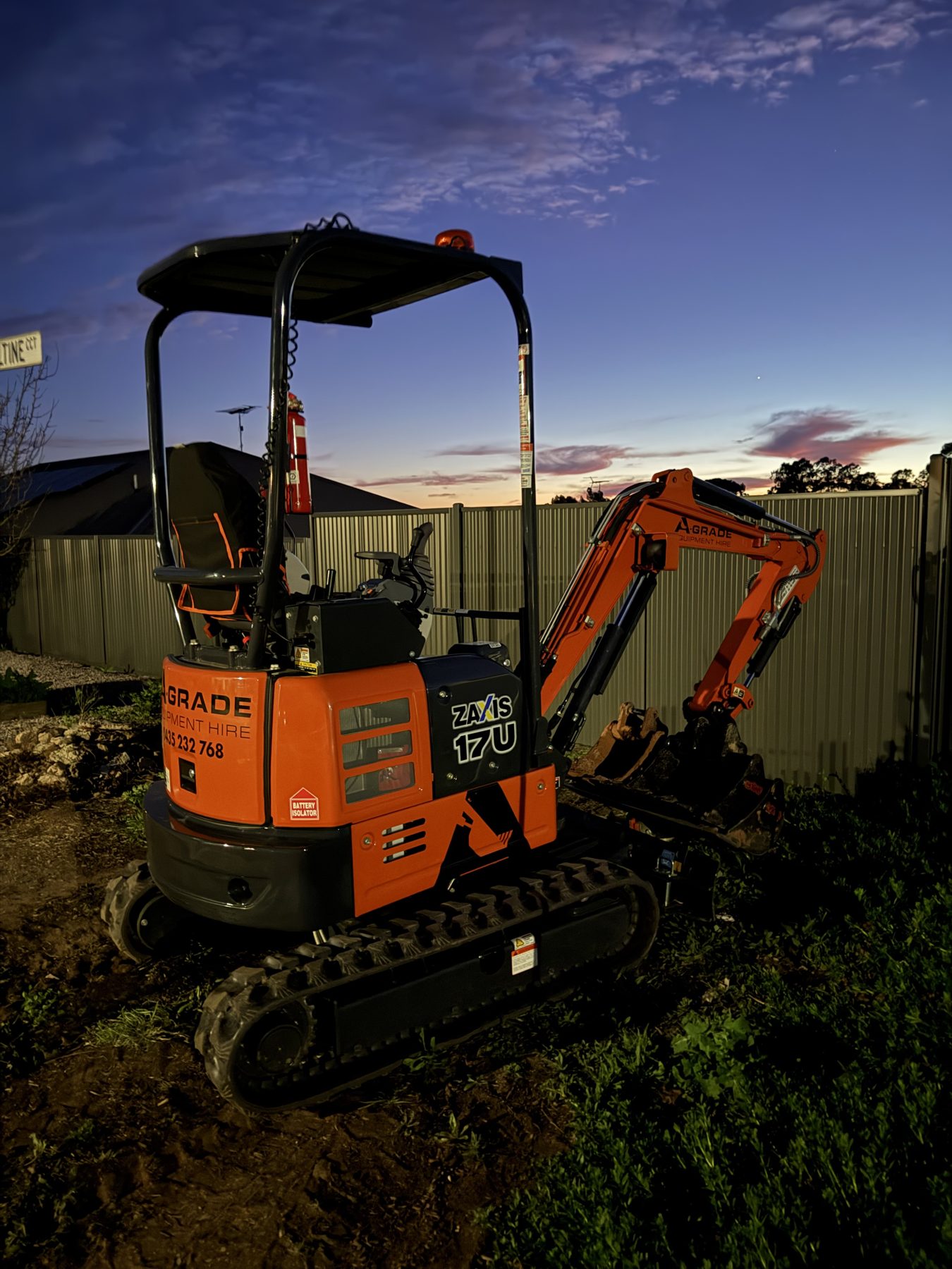 A-Grade mini excavator at dusk