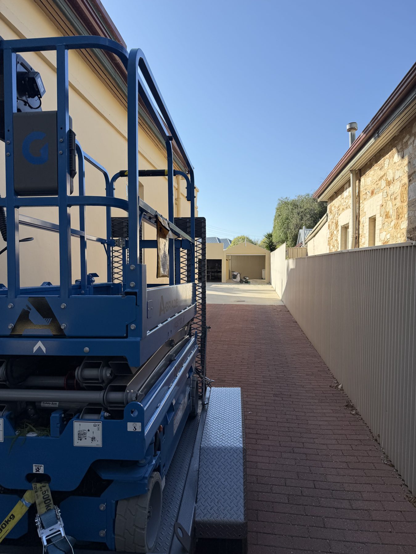 Scissor lift delivered down a narrow laneway