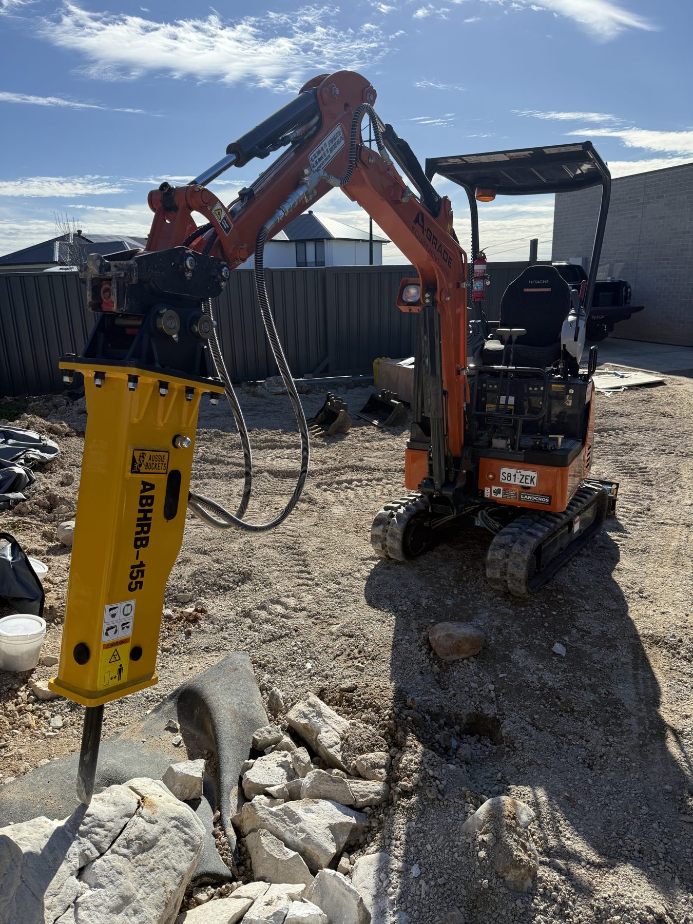 Rock breaker attachment on an A-Grade mini excavator